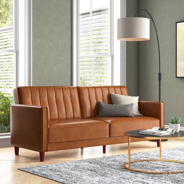 A brown faux leather sofa.
