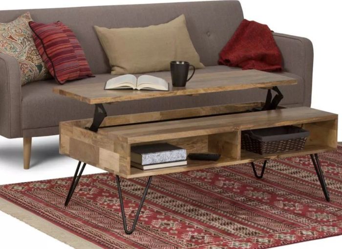 The table with its top lifted, holding a book and a coffee mug