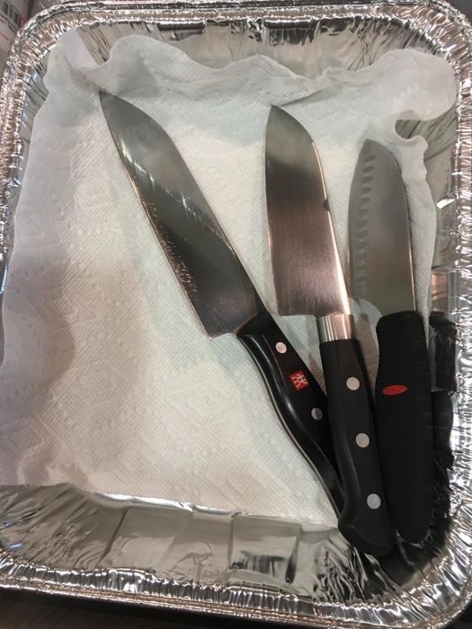 The knives of the reviewer stored in an aluminum container.