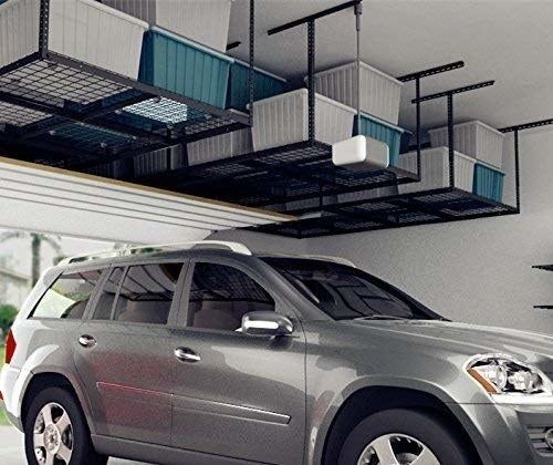 Another picture of the overhead storage unit filled with bins above a car.