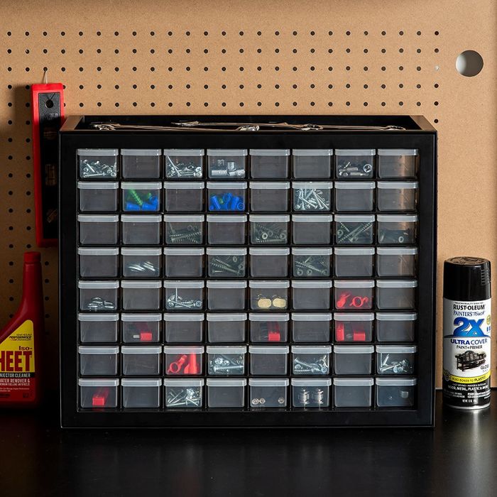 a set of small storage drawers filled with nuts and bolts