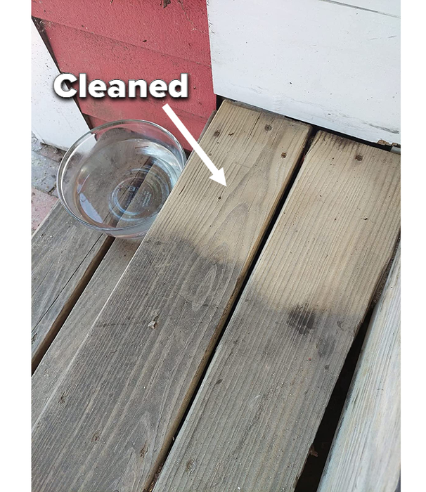 A photo from a reviewer showing a clean section of their deck next to an unbrushed part.