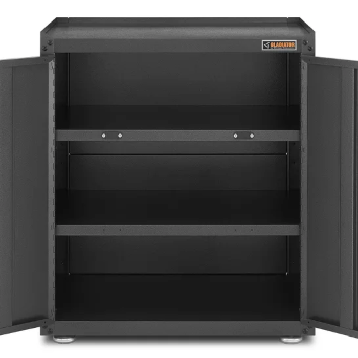 The storage cabinet with its doors open, revealing two shelves inside.