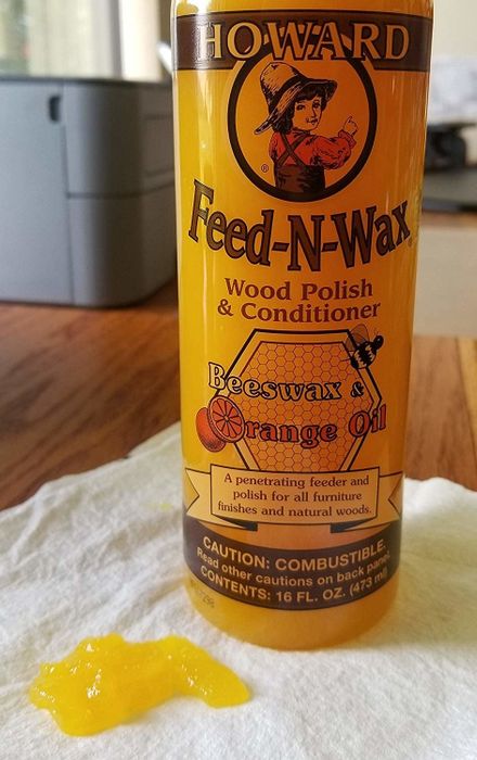 The bottle of wood polish.