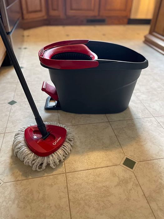 The mop and bucket resting on a reviewer's floor