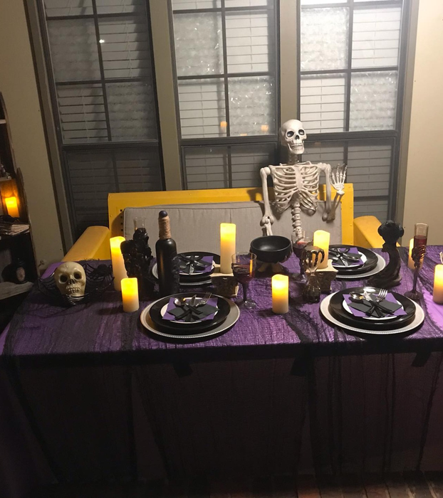A reviewer's Halloween table adorned with flameless candles