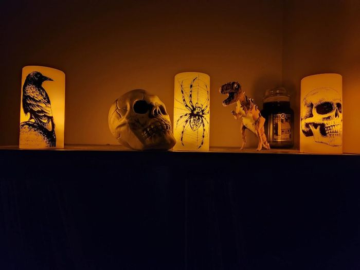 A reviewer's table showcasing candles surrounded by various decorative items