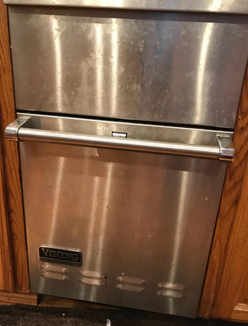 Reviewer image of a dirty fridge