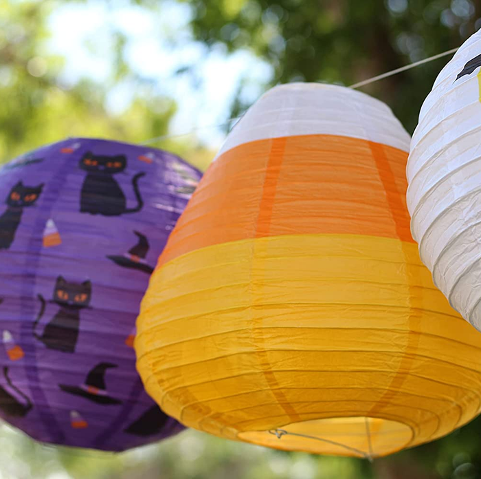 candy corn lantern next to other seasonal designs