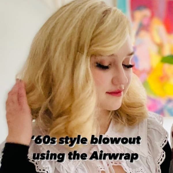 The author rocking a '60s inspired blowout styled using the Airwrap, for a bold, retro finish.