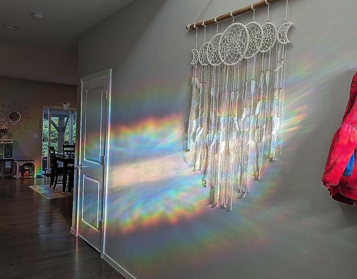 The decals casting reflections onto a reviewer's bedroom wall