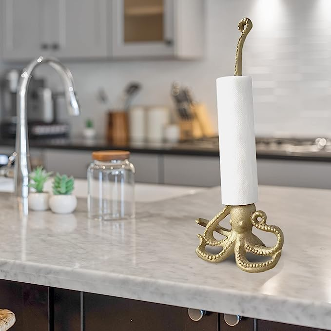 An octopus-shaped holder with a paper towel wrapped around one of its tentacles