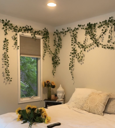 A bedroom featuring vines hanging gracefully from the ceiling.