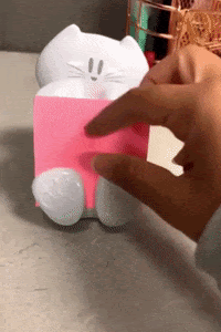 A reviewer pulling a Post-It note from the holder