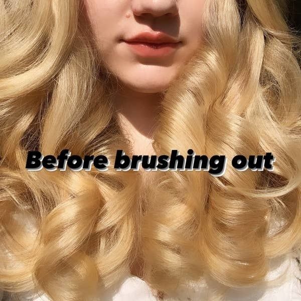 The author's hair styled with soft, pre-brushed curls, showcasing a textured, voluminous look.