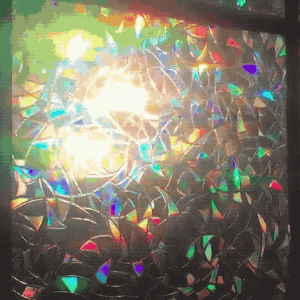 A gif showing light passing through the film, creating rainbow patterns across the surface.