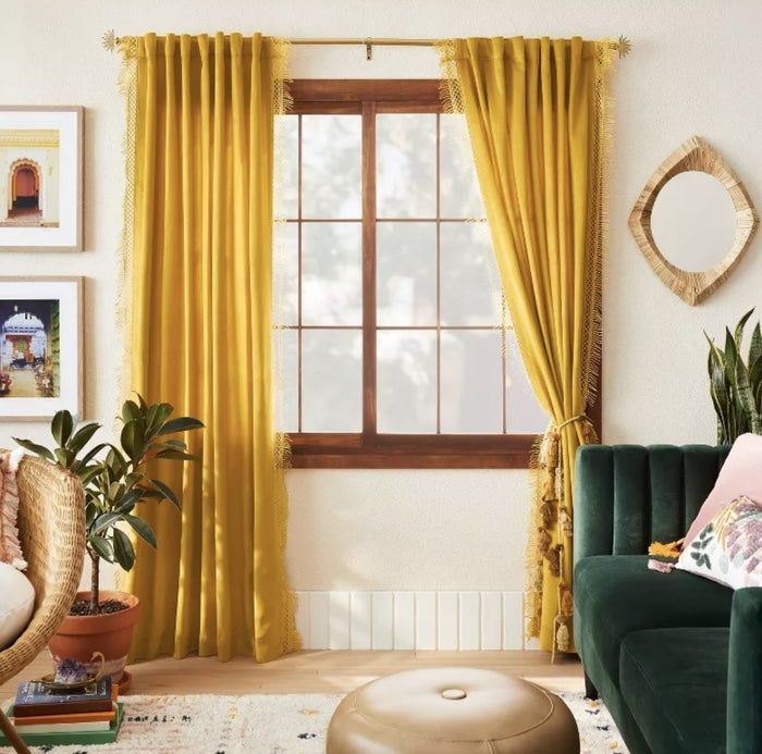 A set of golden yellow velvet curtains