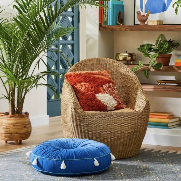 A blue oversized floor pillow