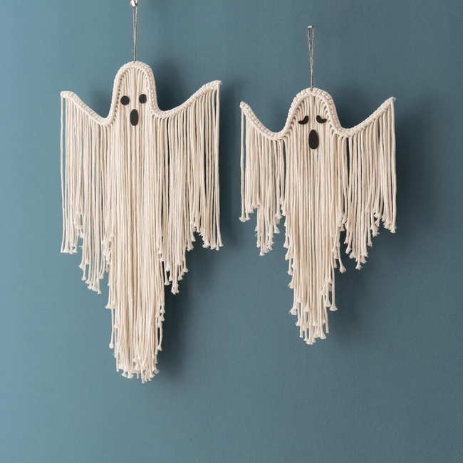 Two macrame ghost ornaments featuring dangling tassels, perfect for adding a haunting touch to your Halloween vibe