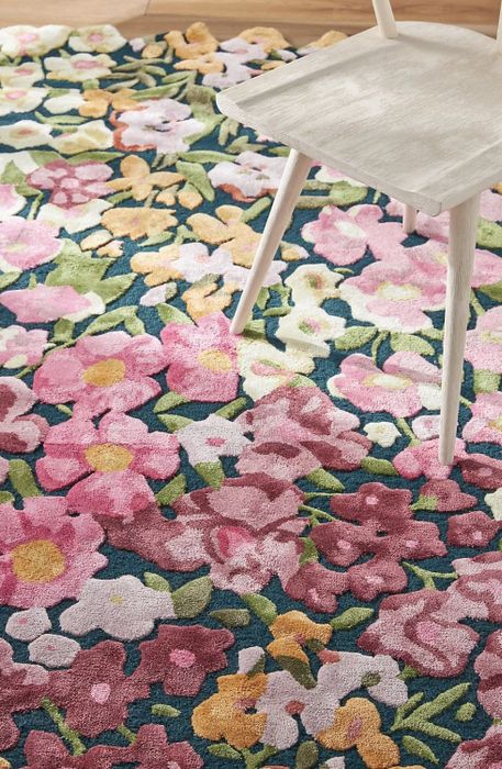 A close-up of the rug placed under a chair