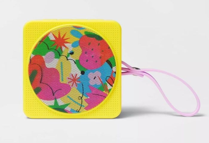 The yellow portable speaker with a strap