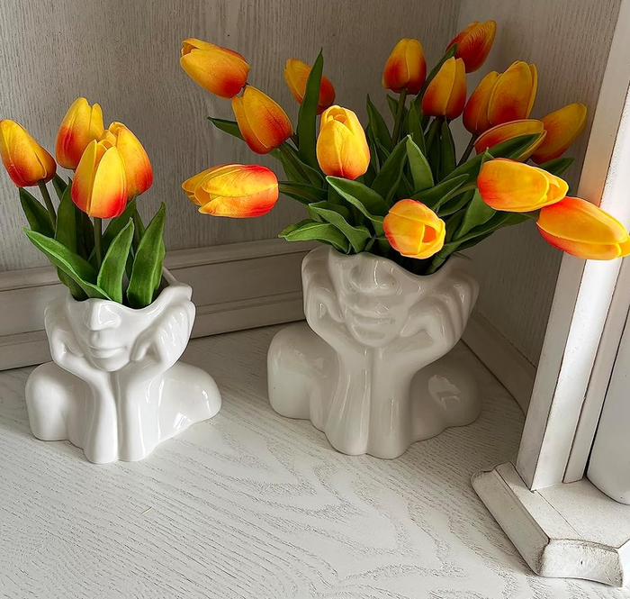 Another reviewer's head vases filled with vibrant tulips