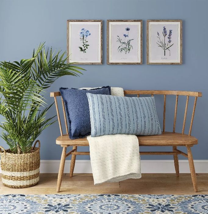 The three botanical prints displayed on a wall