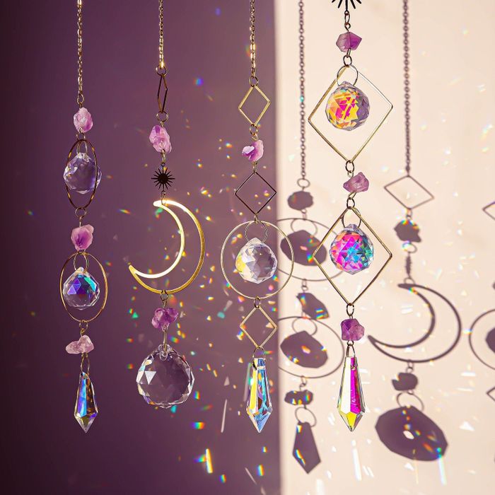 The four sun catchers basking in the sunlight, casting colorful reflections.