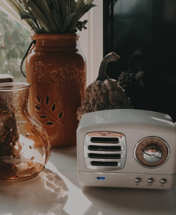 Another reviewer's small white retro Bluetooth speaker, perfect for adding a nostalgic touch to any room.