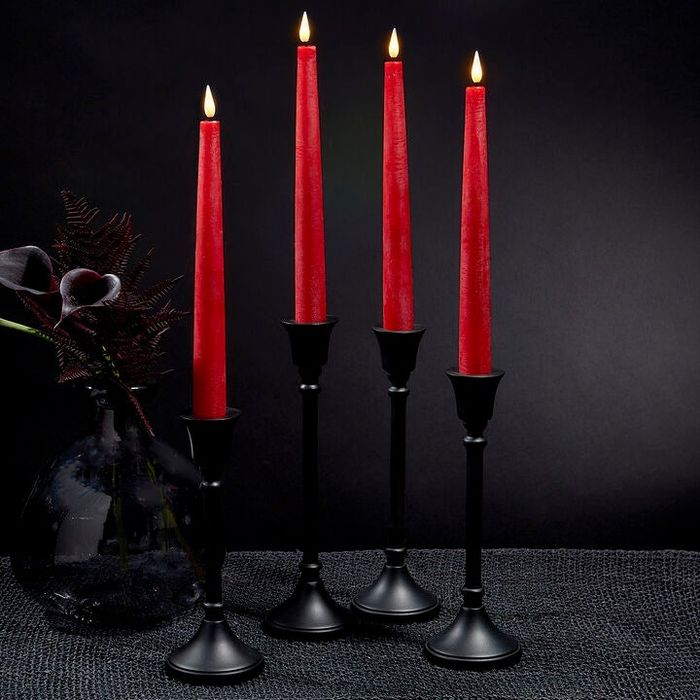 Four red taper candles with realistic fake flames