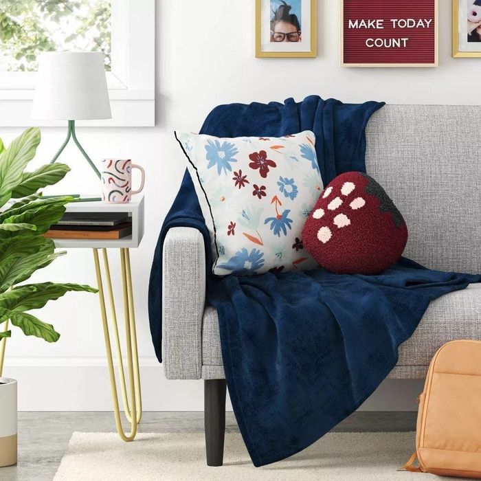 The floral cushion resting on a couch