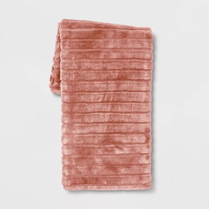 light red textured faux fur blanket