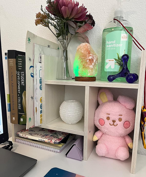 Another reviewer’s white wood shelves used to organize desk essentials