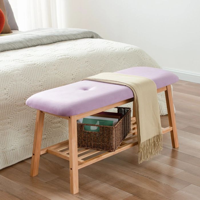 The purple storage bench holding a storage box on the lower shelf and a scarf draped on top.