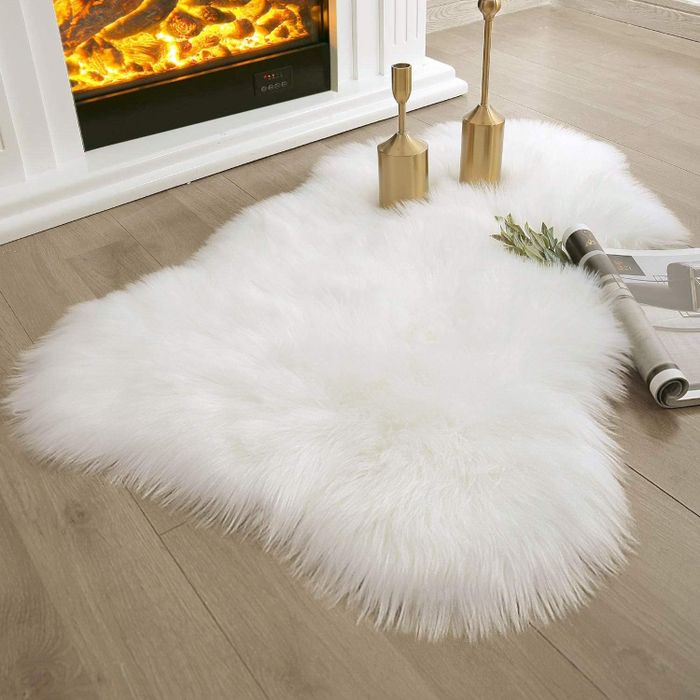 The white rug placed on a floor