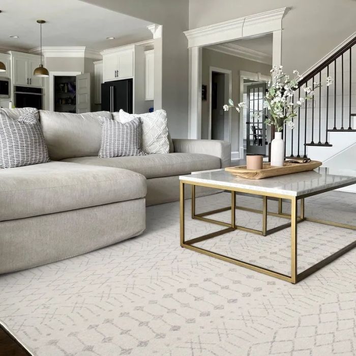 A white rug adorned with beige line designs throughout