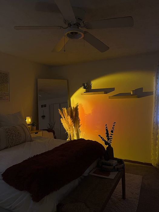 the same users' rooms at night, illuminated by the lamp's warm glow