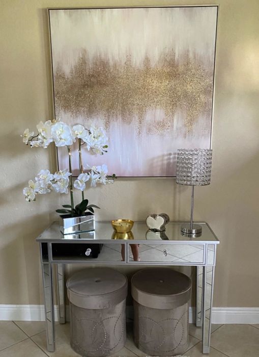 A different reviewer uses the mirrored desk as an entryway console in their home, showcasing its versatility.
