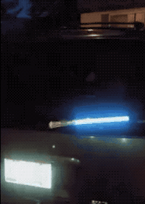 A gif showing the glowing lightsaber wiper blade on a car