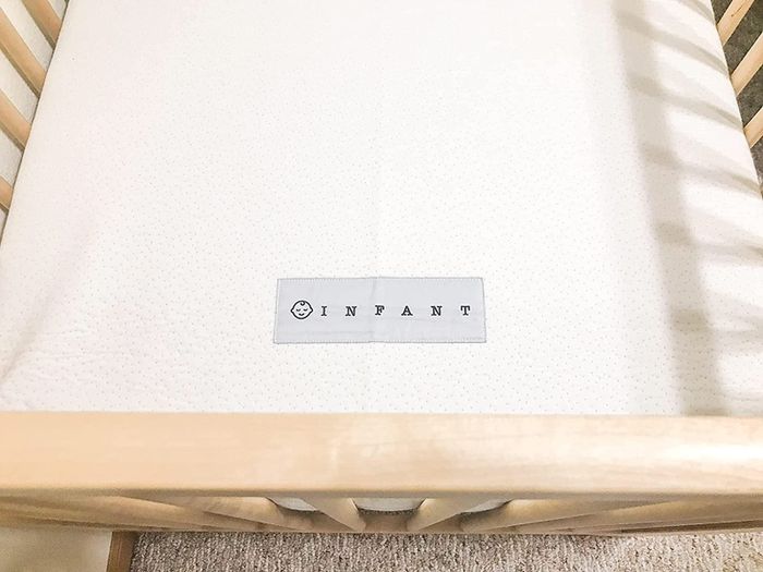A close-up of the reviewer’s mattress is displayed