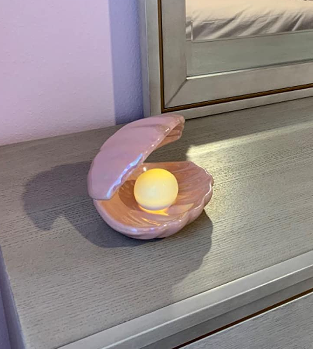 The same shell in pink, glowing with LED light