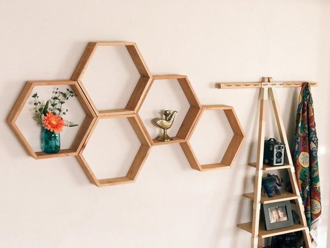 The shelves displaying a beautiful arrangement of flowers and a figurine.