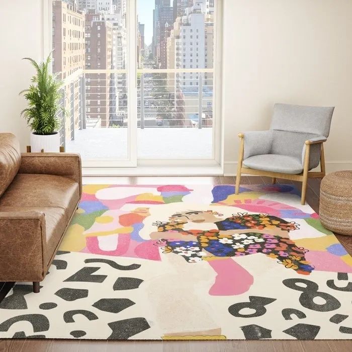 A vibrant, rainbow color-blocked rug featuring an illustration of a person donning a floral sweater, bringing a bold pop of color and style to your room.