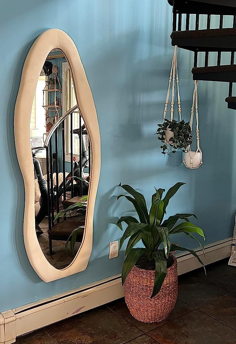 Another reviewer shows off the mirror hanging on the wall.