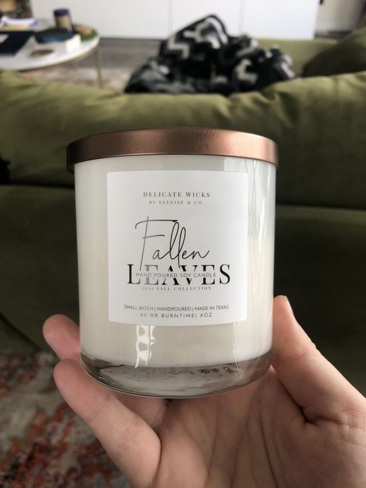 I am holding a glass candle jar.