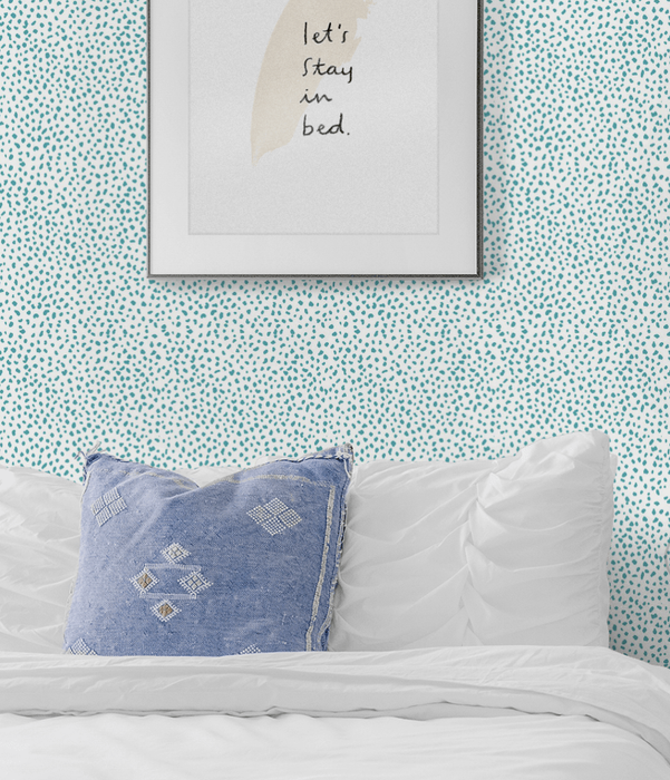 Blue speckled wallpaper adorning the walls of a bedroom.