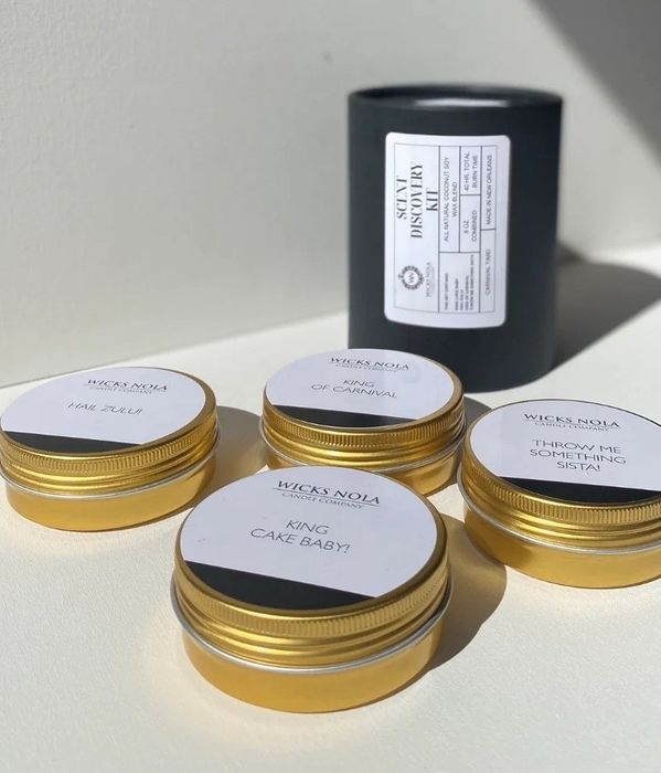 A travel set of candles is shown