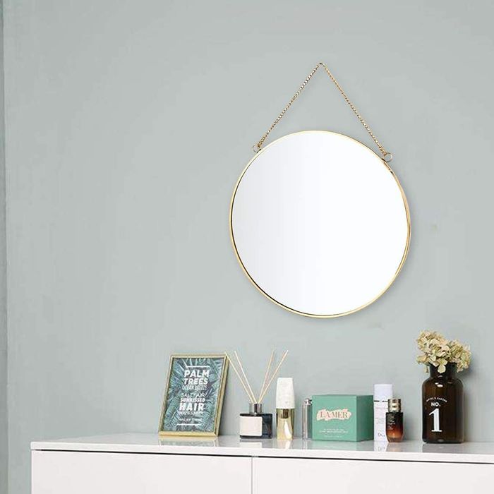 The mirror is displayed above a dresser in a bedroom