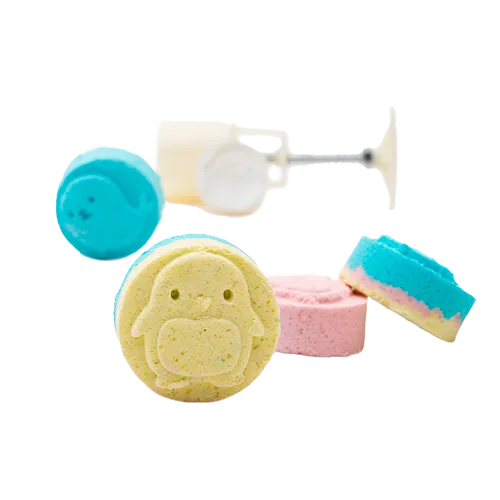 Four brightly colored bath tablets shaped like animals