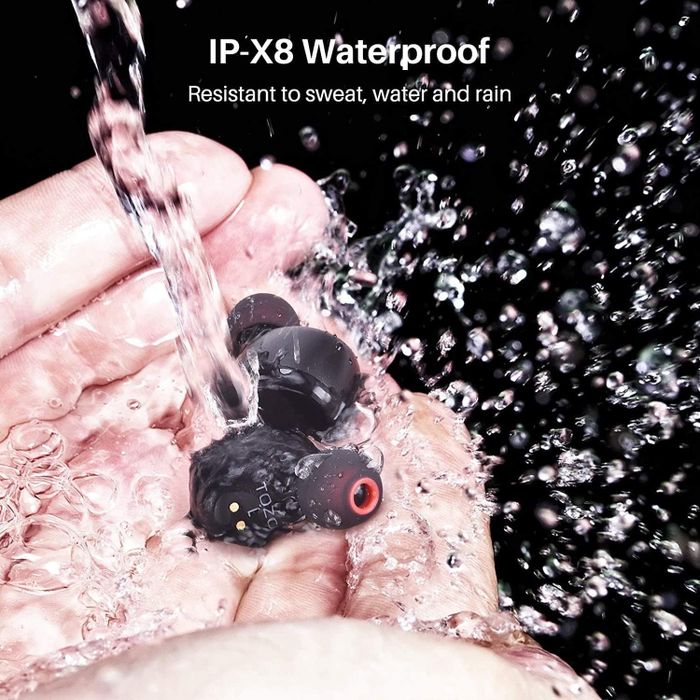 Black earbuds submerged in water